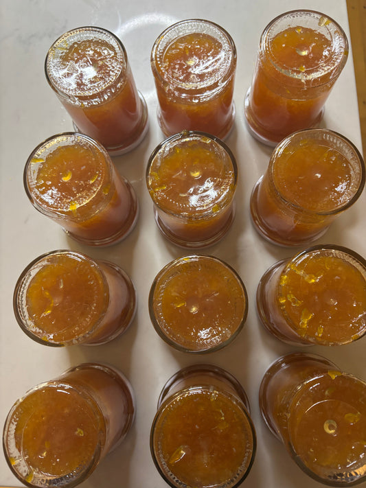 Jam jars filled and inverted upside down after cooking