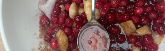 Pears and cranberries macerating for pear and cranberry jam
